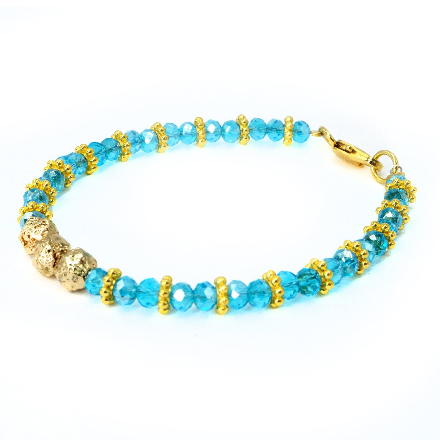 6mm Light Blue Glass Crystal with gold main beads and spacer beads, beaded bracelet. Gold clasp.