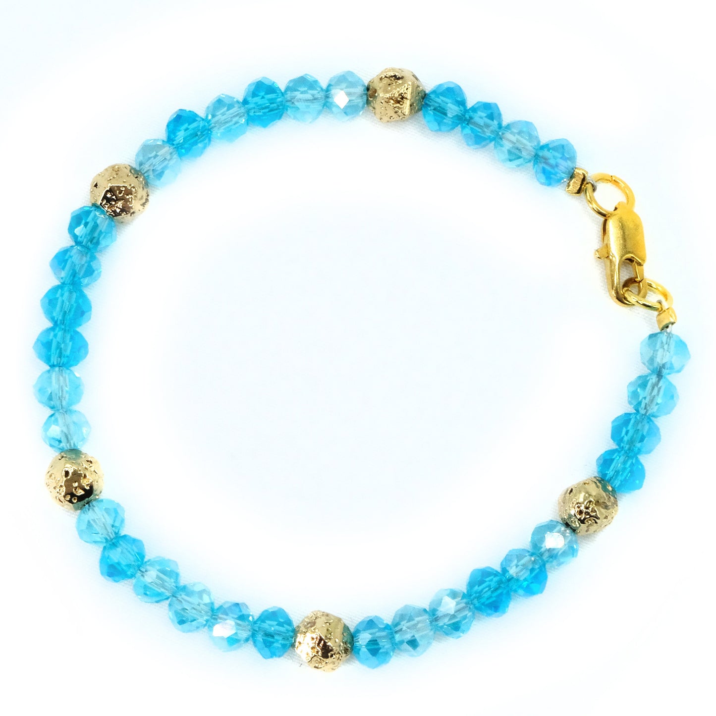 6mm Light Blue Glass Crystal with gold spacer beads, beaded bracelet. Gold clasp.
