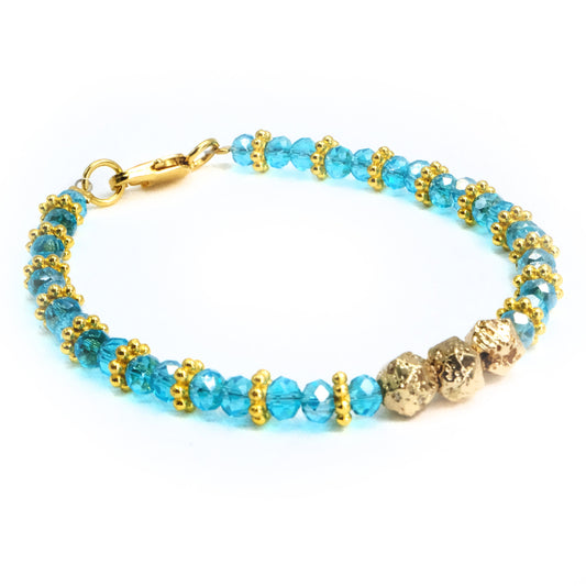 6mm Light Blue Glass Crystal with gold main beads and spacer beads, beaded bracelet. Gold clasp.