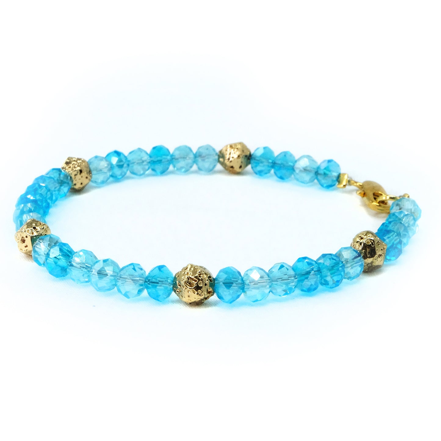 6mm Light Blue Glass Crystal with gold spacer beads, beaded bracelet. Gold clasp.